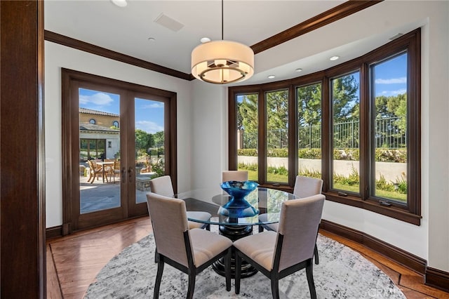 7 Shoreview, Newport Coast, CA 92657 - dining area with ornamental molding, french doors, wood finished floors, and recessed lighting