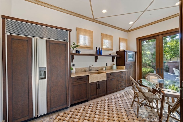 7 Shoreview, Newport Coast, CA 92657 - kitchen featuring paneled built in fridge, open shelves, light countertops, french doors, and dark brown cabinetry