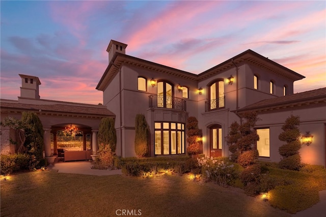 7 Shoreview, Newport Coast, CA 92657 - back of house featuring a balcony, stucco siding, and a patio area