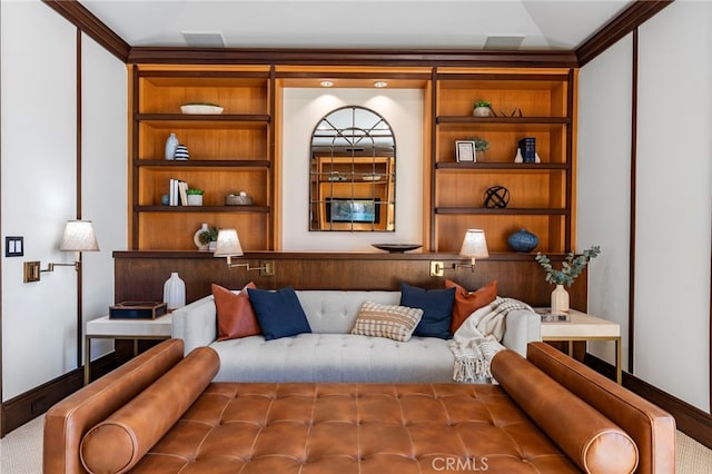 sitting room featuring built in features and ornamental molding