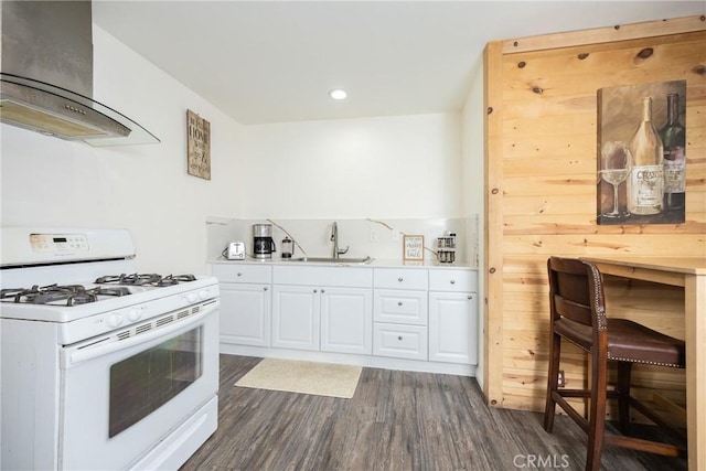 kitchen with white cabinetry, white gas stove, sink, dark wood-type flooring, and extractor fan