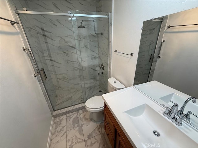 bathroom with vanity, toilet, and an enclosed shower