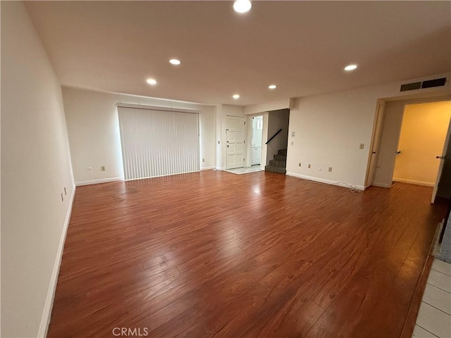 empty room with wood-type flooring