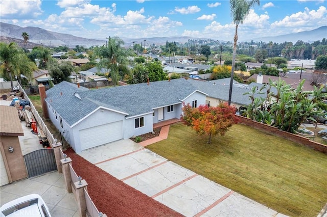 birds eye view of property with a mountain view