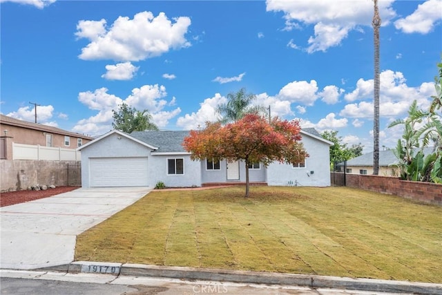 view of front of home featuring a front lawn and a garage