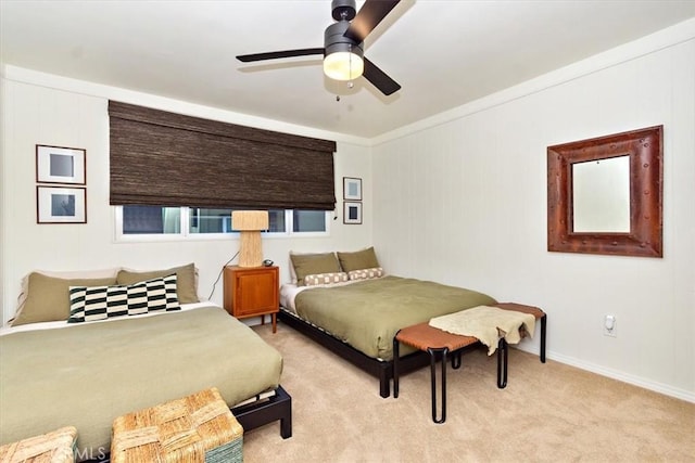 bedroom featuring ceiling fan, light colored carpet, and crown molding