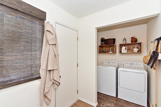 laundry area featuring dark hardwood / wood-style flooring and washer and dryer