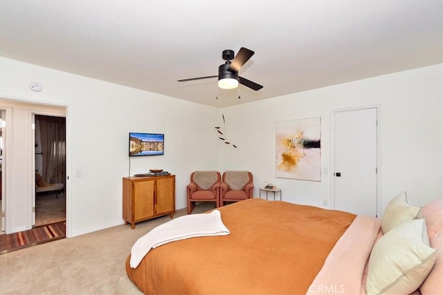 carpeted bedroom featuring ceiling fan