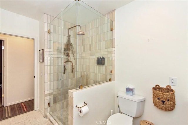 bathroom with tile patterned floors, an enclosed shower, and toilet