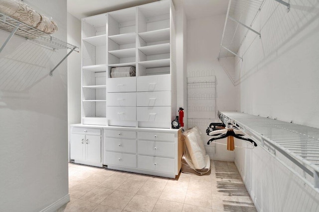 walk in closet featuring light tile patterned floors