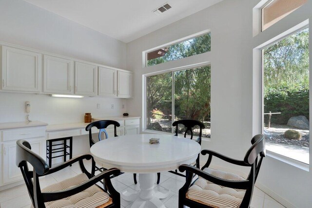 dining space featuring light tile patterned floors