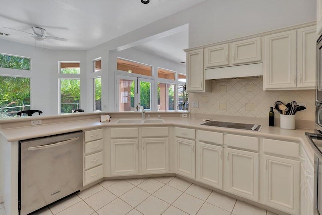 kitchen with dishwasher, black electric stovetop, tasteful backsplash, sink, and ceiling fan