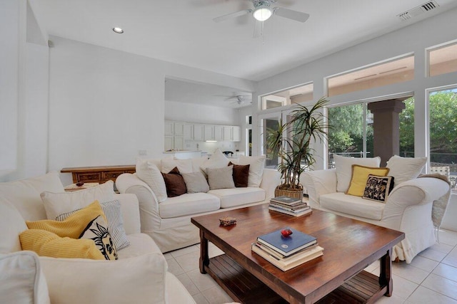 living room with ceiling fan and light tile patterned floors