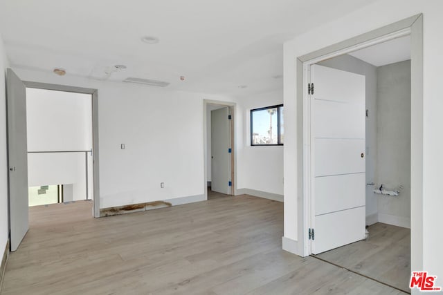 empty room featuring light hardwood / wood-style floors