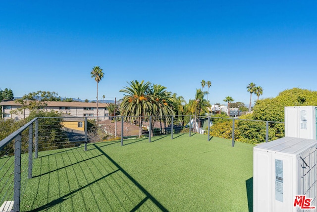 view of home's community featuring a yard