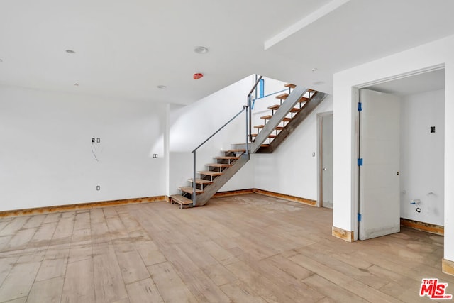 unfurnished living room with light hardwood / wood-style flooring