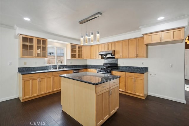 kitchen with ventilation hood, black gas range oven, light brown cabinetry, a kitchen island, and dark hardwood / wood-style flooring