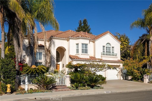 mediterranean / spanish-style home featuring a garage