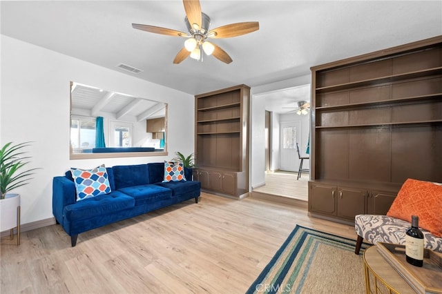 living room with lofted ceiling with beams, ceiling fan, and light hardwood / wood-style floors