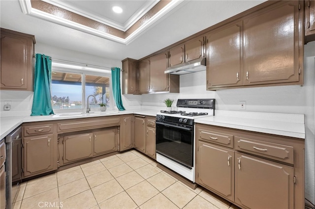 kitchen with range, sink, and light tile patterned floors