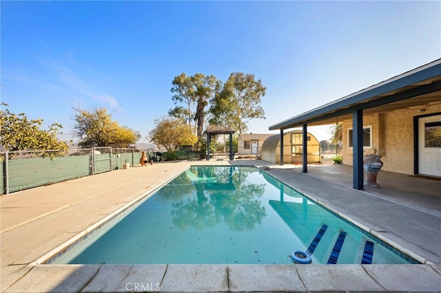 view of swimming pool featuring a patio area