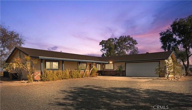 ranch-style home with a garage