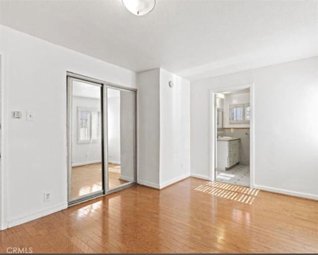 spare room featuring hardwood / wood-style flooring