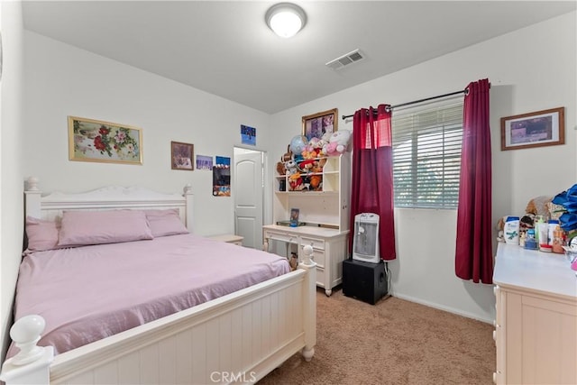 bedroom with light colored carpet