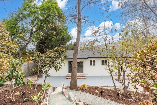 back of house with a patio