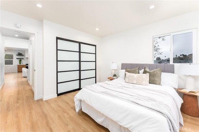 bedroom with light hardwood / wood-style flooring