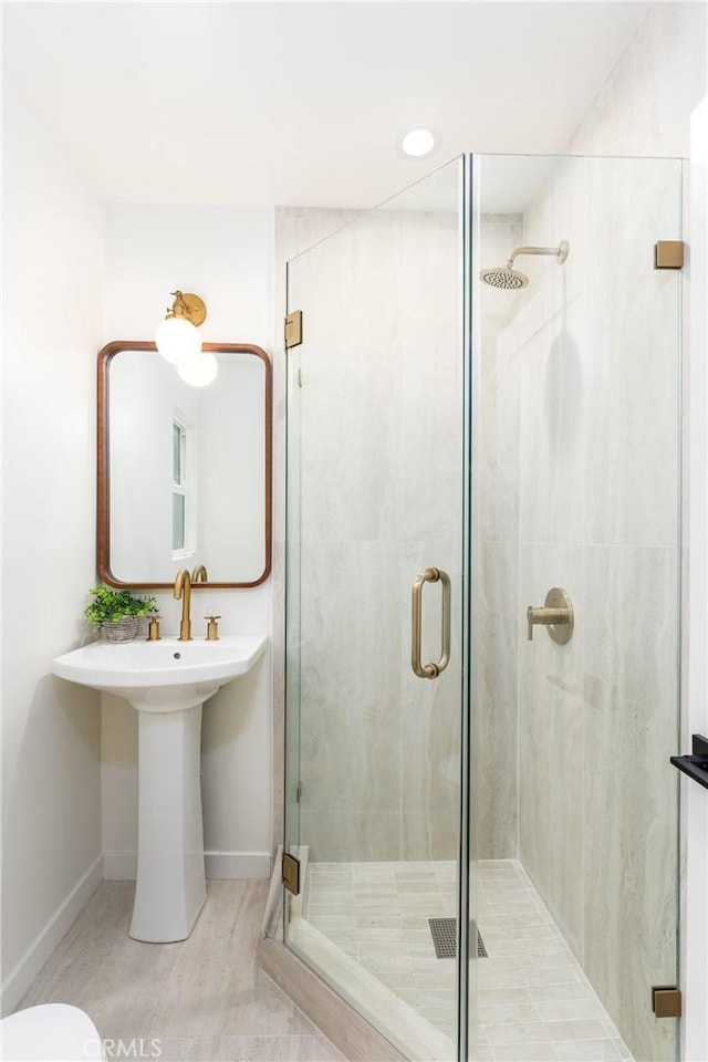 bathroom featuring tile patterned floors and a shower with shower door