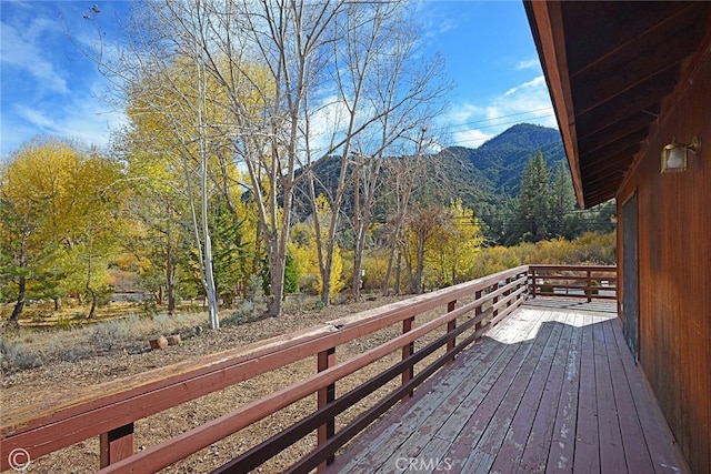 wooden terrace with a mountain view