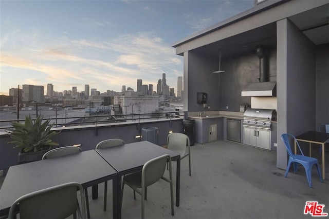 view of patio featuring area for grilling, sink, and an outdoor kitchen