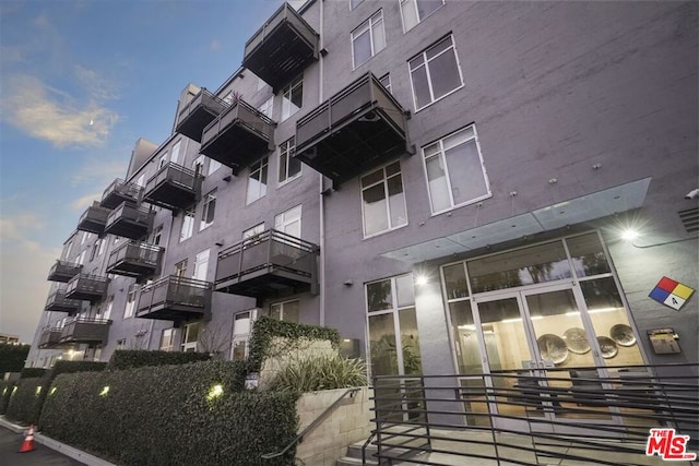 view of outdoor building at dusk