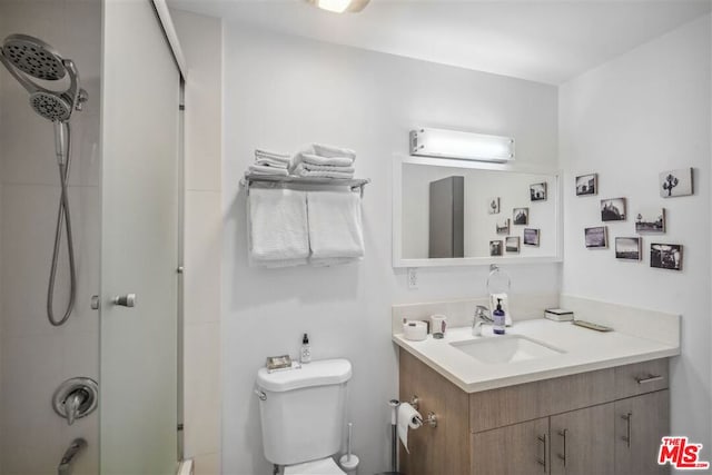 bathroom featuring vanity, toilet, an enclosed shower, and a wall unit AC