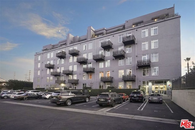 view of outdoor building at dusk