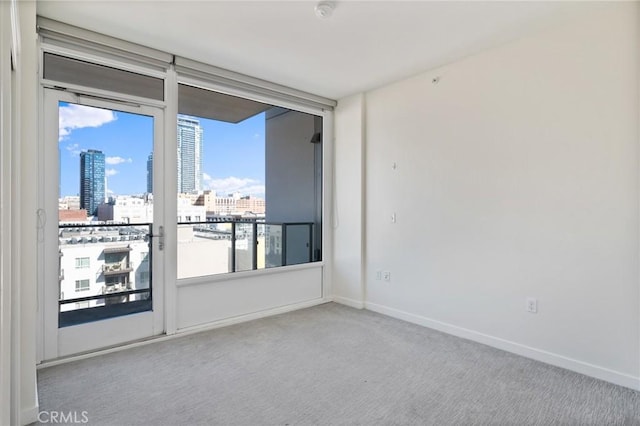 unfurnished room with light carpet