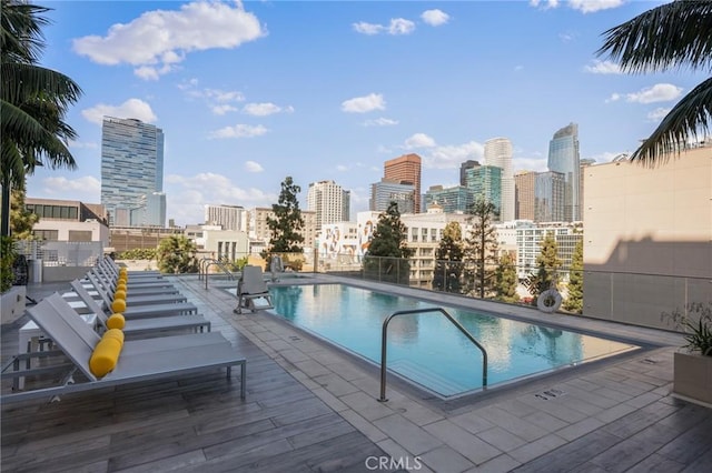 view of swimming pool with a patio