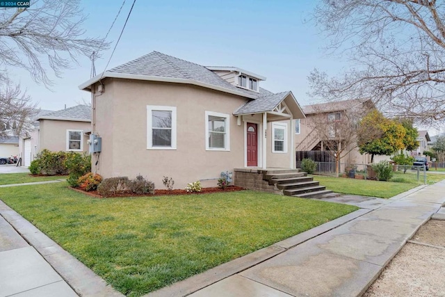 bungalow-style home featuring a front yard