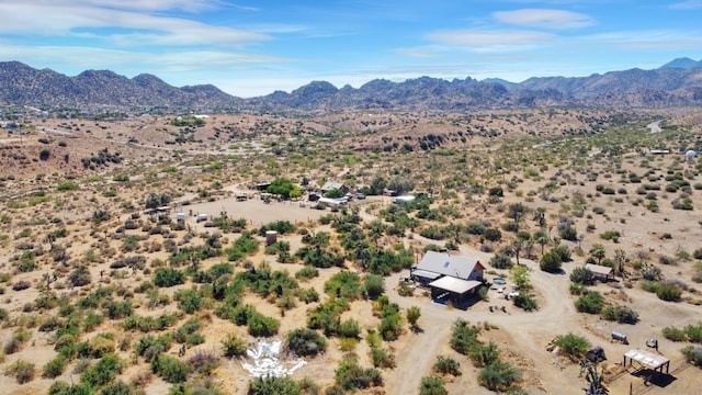 birds eye view of property with a mountain view