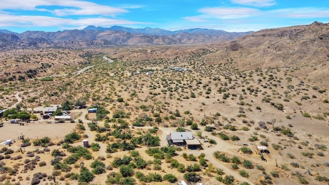 birds eye view of property featuring a mountain view