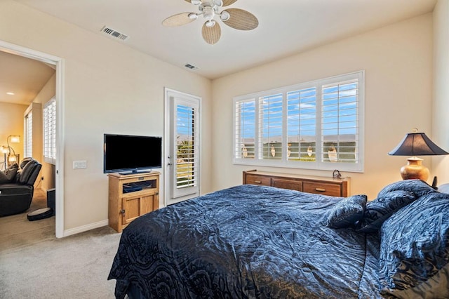 carpeted bedroom featuring ceiling fan and access to exterior