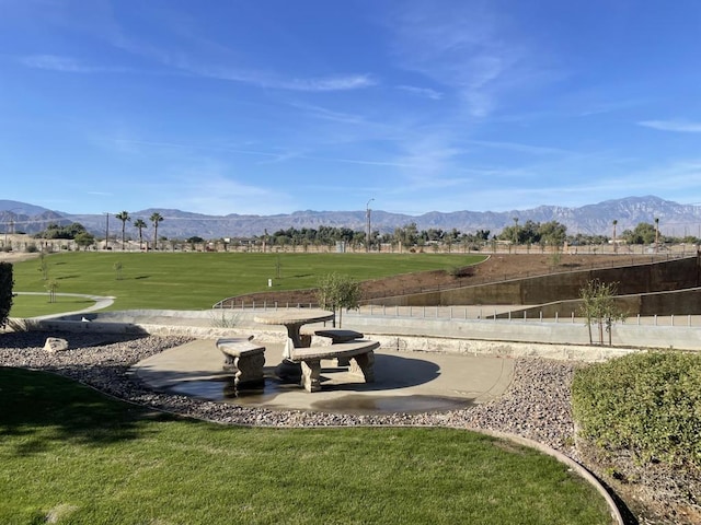 exterior space featuring a mountain view and a yard