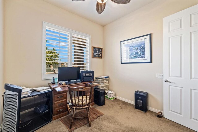 office area featuring ceiling fan and light colored carpet