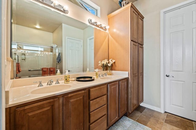 bathroom featuring vanity and a shower with door