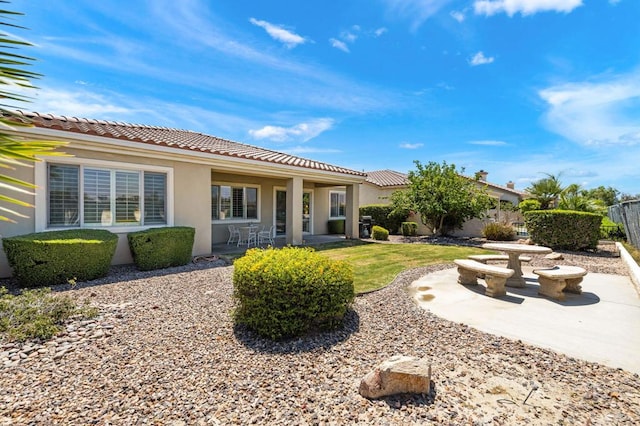 back of property featuring a patio area