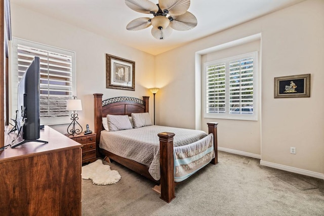 bedroom featuring ceiling fan and light colored carpet