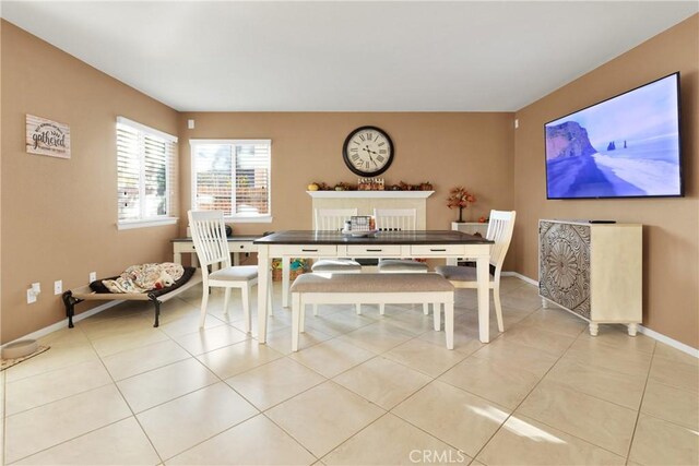 dining area with light tile patterned floors