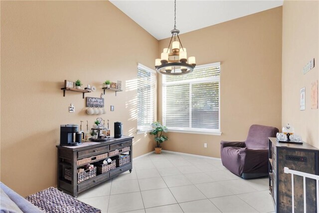 living area with light tile patterned floors, vaulted ceiling, and an inviting chandelier