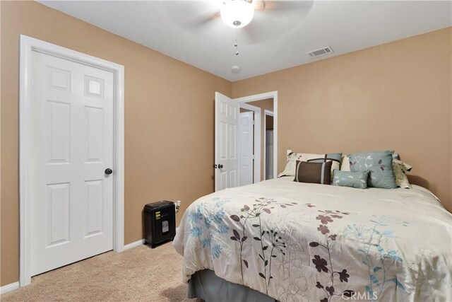 carpeted bedroom with ceiling fan